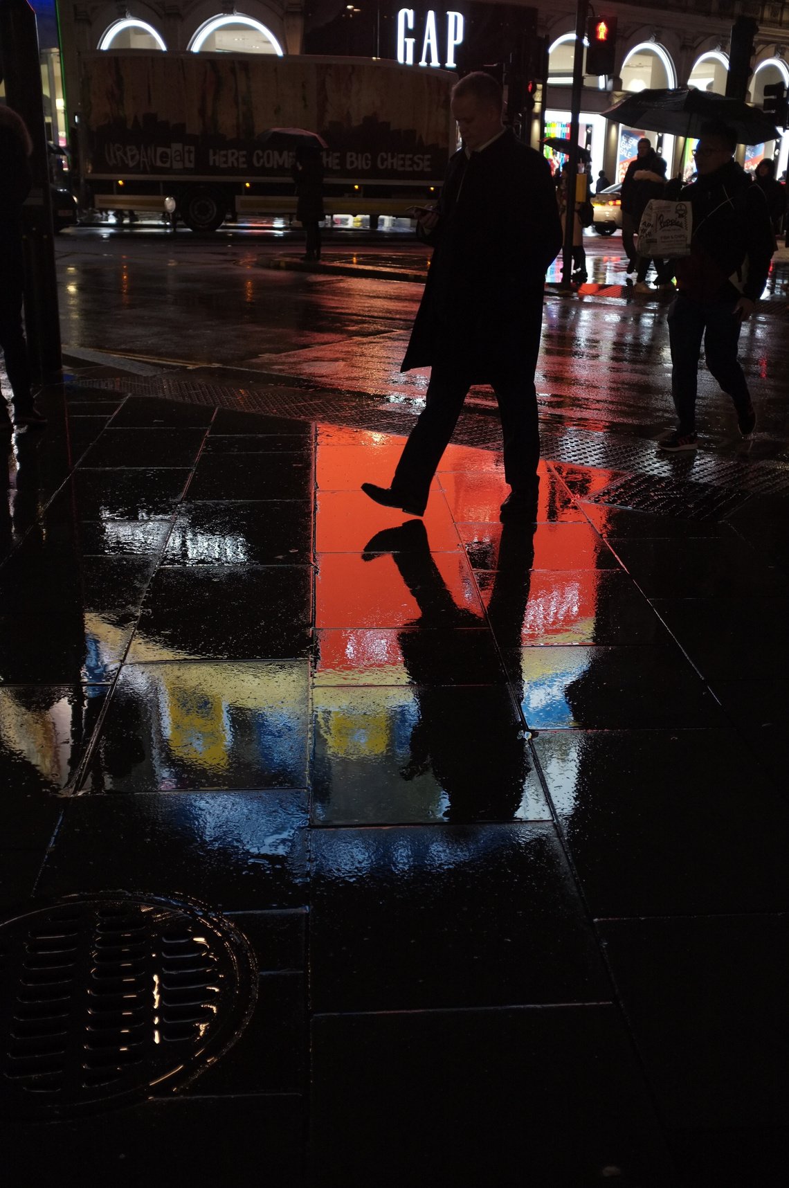 Shadowy night street photograph in Picadilly Circus. London