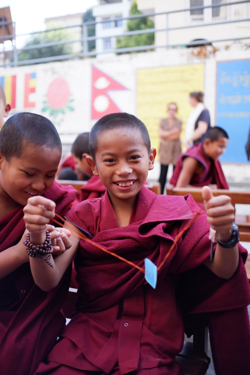 Young Tibetan Buddhist Monks playing.